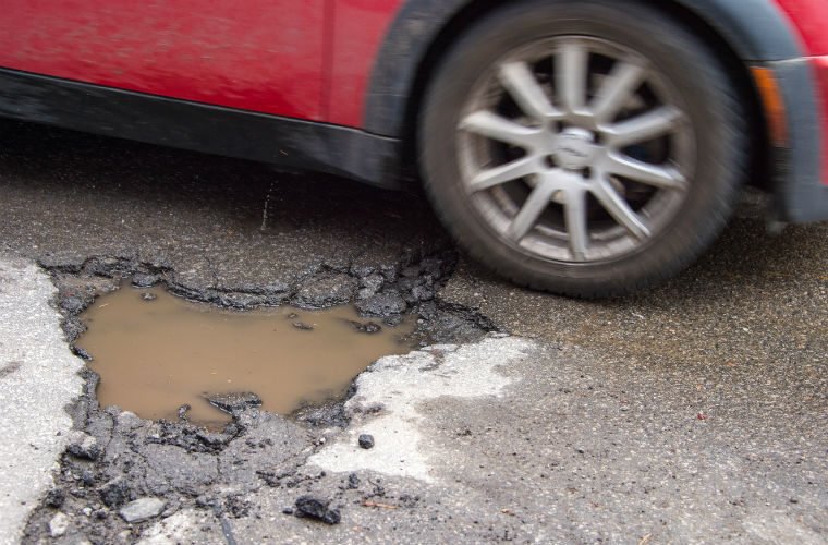Potholes seen to be damaging multiple vehicles weekly at Shropshire Tyre Centre 1 Pothole