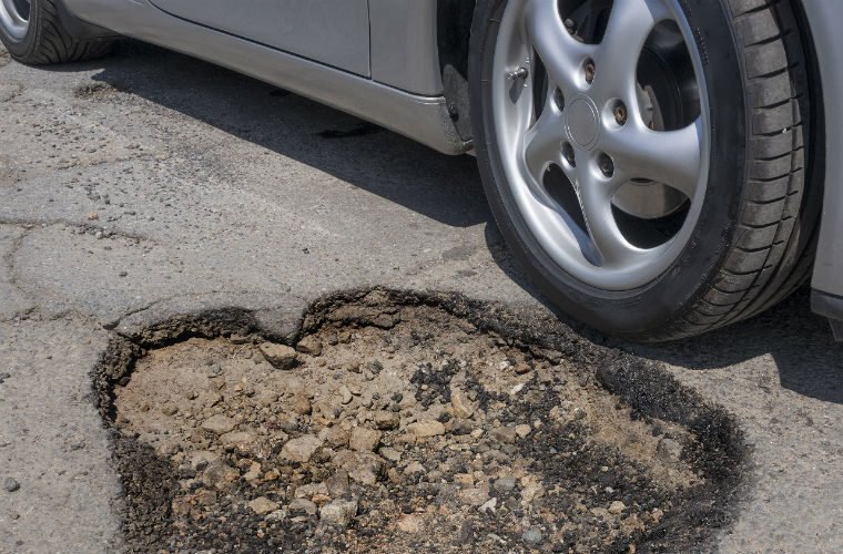 A35 Pothole causes damage to 60 vehicles in one week 1 bigstock Pothole avoidance concept 492557061